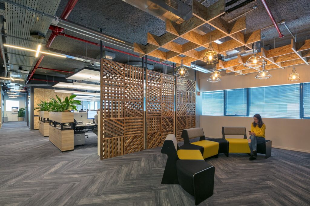 Lounge seating beneath timber ceiling battens at the DellEMC Herzliya offices