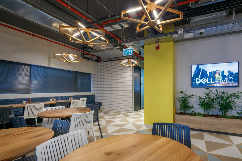 Open-plan work area with exposed services ceiling at the DellEMC Herzliya offices