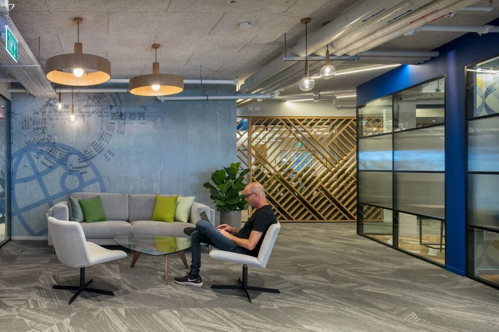 Lounge seating beside a glazed wall at the Jabil Optics facility