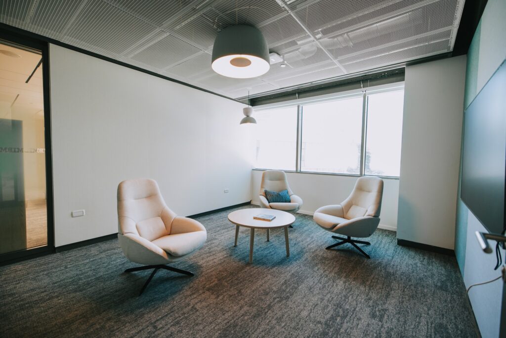 Seating area with armchairs beside a glazed partition at the IBM offices