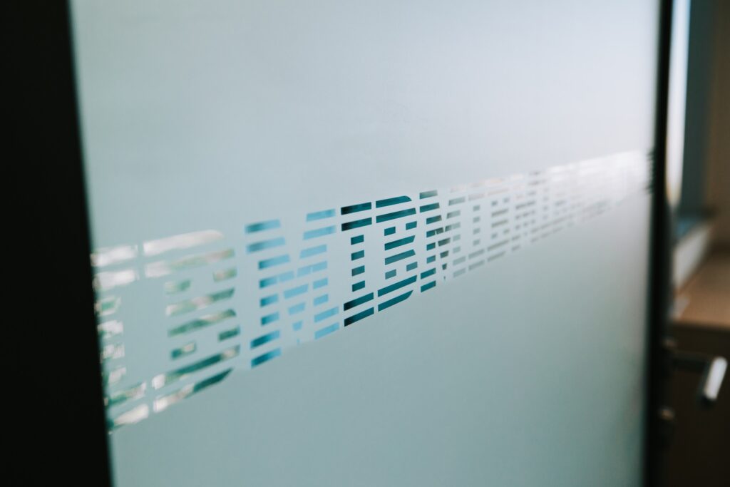 Glass partition with frosted IBM branding at the IBM offices