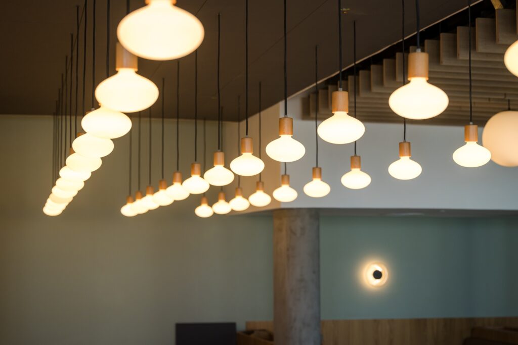 Corridor lit by suspended globe pendants at the IBM offices