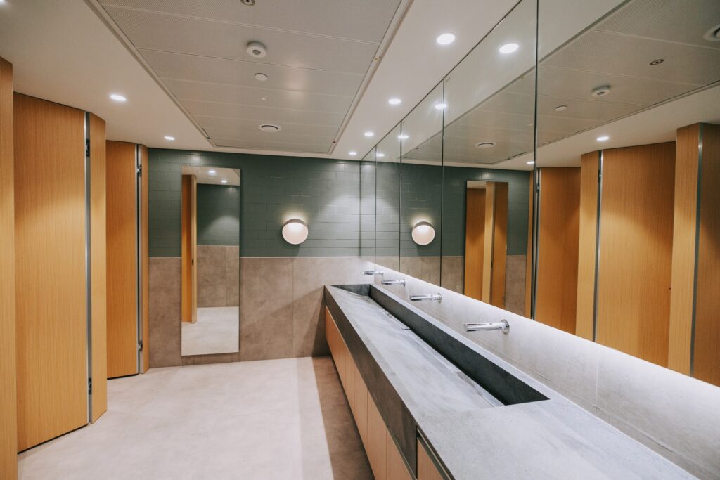 Long reception counter in a timber-panelled corridor at the IBM offices