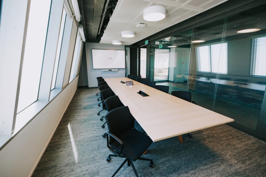 Boardroom with a long table and a city view in a Domark office project