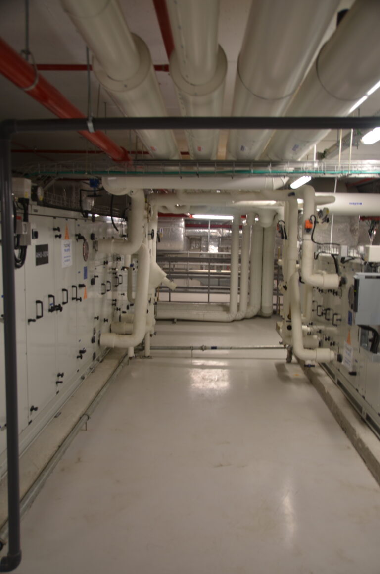 Service corridor lined with electrical panels at the Rafa facility
