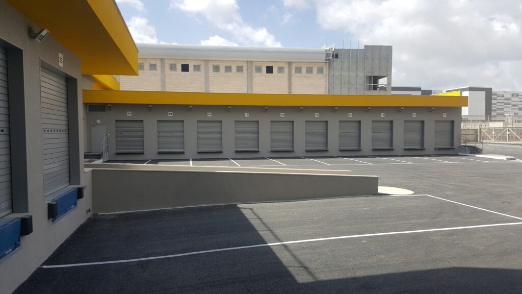 Loading bays along the facade of the DHL Mevo Carmel centre