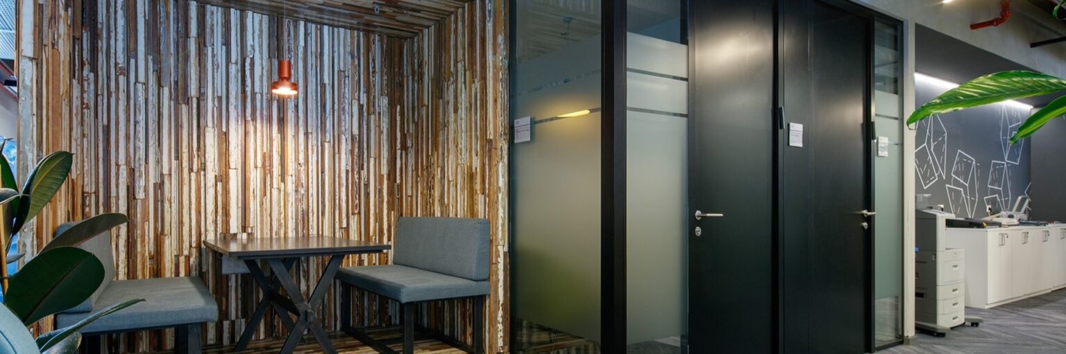 Corridor with timber slat screening and glazed doors at the DellEMC Herzliya offices