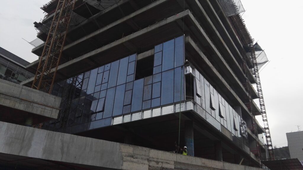 Low-angle view of the glass and steel facade of the Mellanox complex