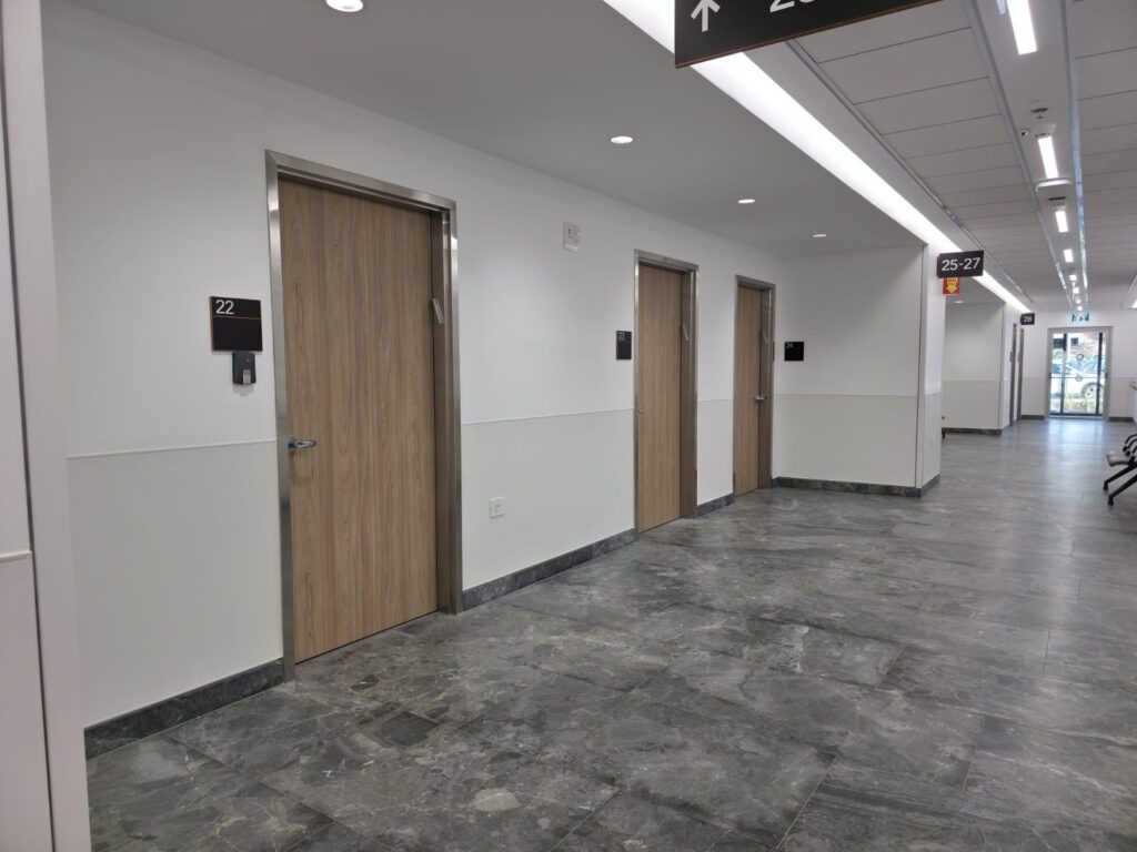 Clinic corridor with treatment room doors at Beit Shulamit