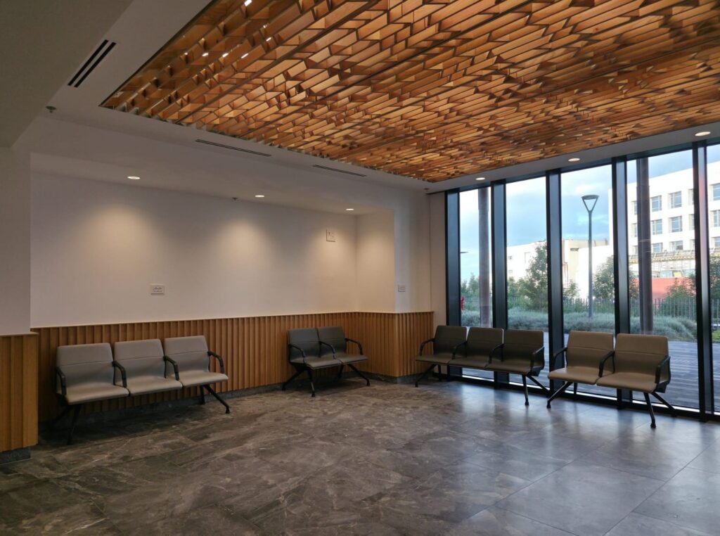Waiting area with a wood block ceiling at Beit Shulamit