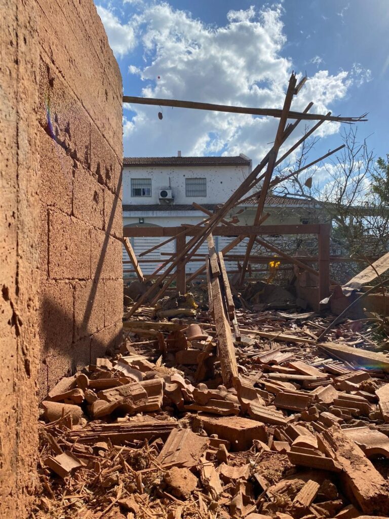 A tiled roof in ruins after a strike